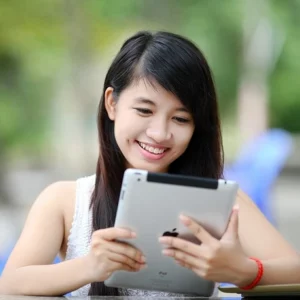 A woman viewing a virtual gift e-card on her iPad