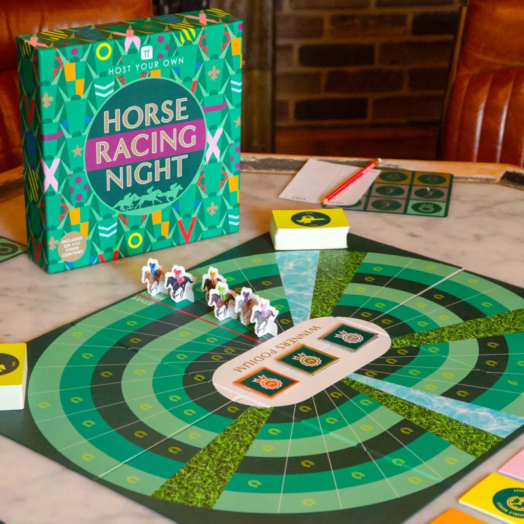 Horse Racing Night board game by Talking Tables with racecourse gameboard laid out on a table